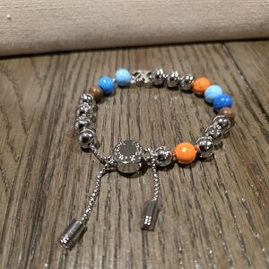 Elegant Silver Bracelet with Blue and Orange Accents
